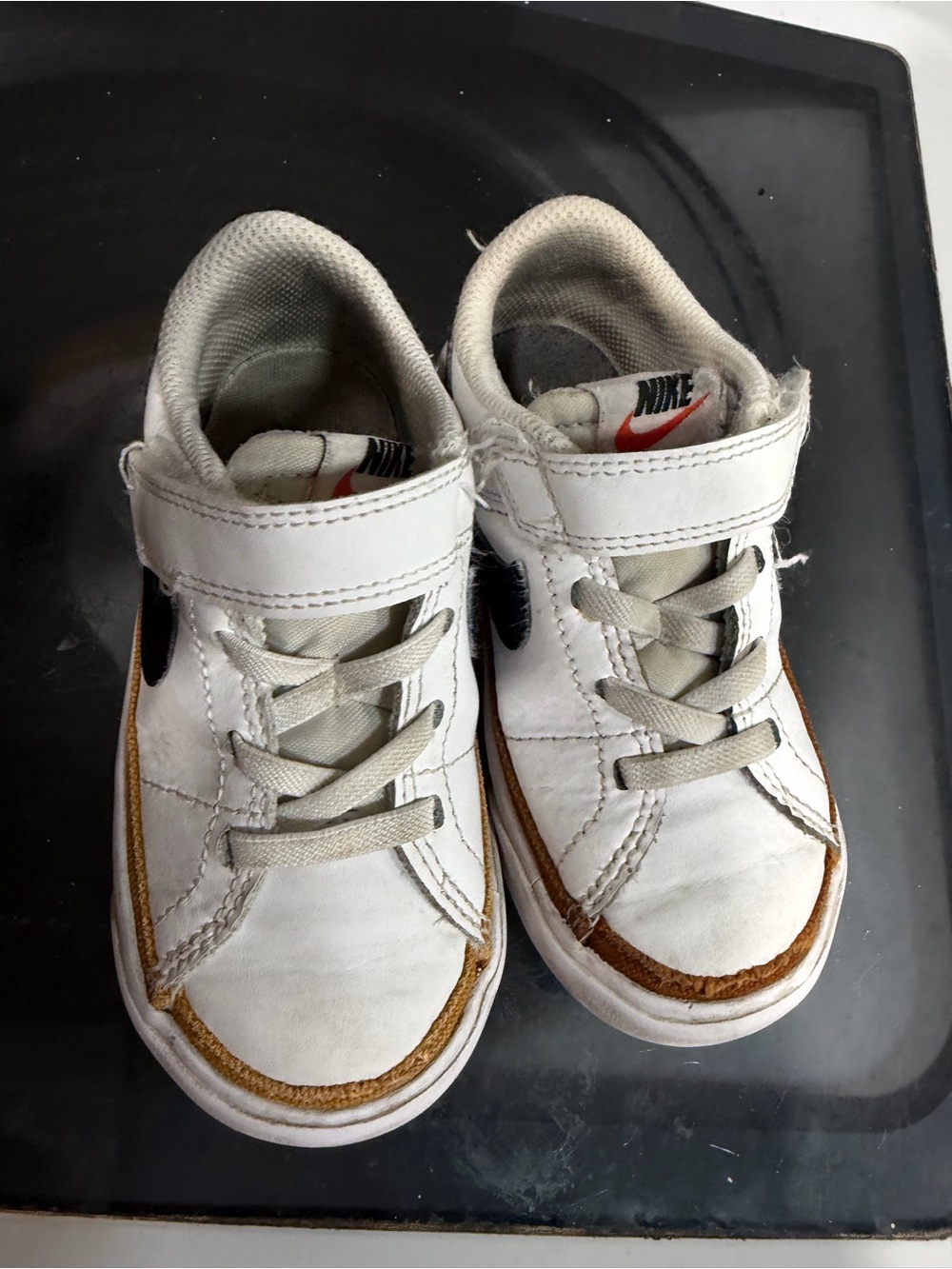 Nike Kids White Sneakers with Brown Accent and Black Swoosh
